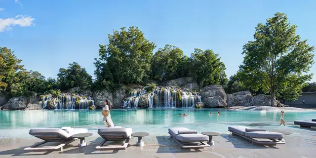 Swimmable forest lagoon with waterfall