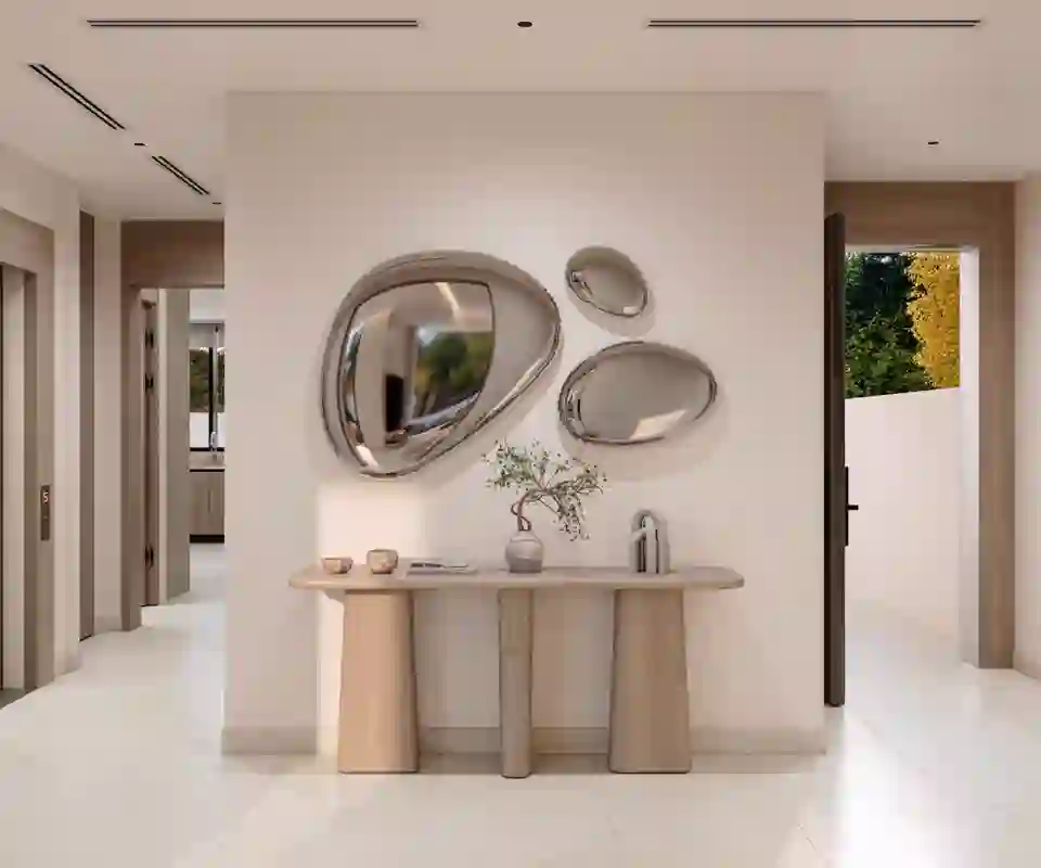 Entrance hall with a console table and sculpted mirrors in a 4-bedroom townhouse